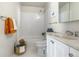 Tidy bathroom with white subway tile, shower-tub, neutral sink, and stylish decor at 1315 Estes St # 13C, Denver, CO 80215