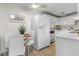 Bright kitchen with modern appliances, eat-in area, and stylish decor at 1315 Estes St # 13C, Denver, CO 80215