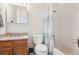 Bathroom featuring a vanity with sink, toilet, and tub with shower at 5733 S Killarney Way, Centennial, CO 80015