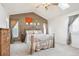 Vaulted ceiling bedroom with skylight, stylish decor, and ample natural light at 5733 S Killarney Way, Centennial, CO 80015