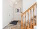 Inviting foyer with a staircase, new carpet, and a front door at 5733 S Killarney Way, Centennial, CO 80015