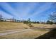 Scenic view of a community greenspace with walking path and lush grass at 5733 S Killarney Way, Centennial, CO 80015