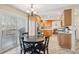 Bright eat-in kitchen featuring wood cabinets, stainless steel appliances, and sliding glass doors to a deck at 5733 S Killarney Way, Centennial, CO 80015