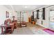 Inviting living room with carpet, sliding doors, a cozy couch, and a wooden coffee table at 5733 S Killarney Way, Centennial, CO 80015