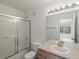 Bathroom featuring a shower with glass doors and a vanity with a sink at 19246 E Carolina Pl # 102, Aurora, CO 80017