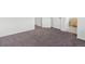 Bedroom features neutral carpeting and paint, with white doors and trim at 19246 E Carolina Pl # 102, Aurora, CO 80017