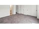 Bedroom featuring neutral carpet and multiple closets at 19246 E Carolina Pl # 102, Aurora, CO 80017
