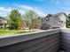 Exterior view from the balcony showing well-maintained landscaping and a residential building at 19246 E Carolina Pl # 102, Aurora, CO 80017