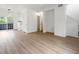 Open-concept living area featuring hardwood floors, neutral paint and plenty of natural light at 19246 E Carolina Pl # 102, Aurora, CO 80017