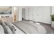 Bedroom featuring neutral carpet, a dresser, and multiple closets at 19246 E Carolina Pl # 102, Aurora, CO 80017