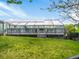 Community indoor pool has a large deck, with views of the blue sky and lawn at 19246 E Carolina Pl # 102, Aurora, CO 80017