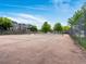 Tennis court with net, fence, and the community homes in the background at 19246 E Carolina Pl # 102, Aurora, CO 80017