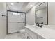 Modern bathroom with white vanity, walk-in shower, and new fixtures at 9525 Damon Dr, Northglenn, CO 80260