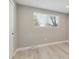 Well-lit bedroom featuring a large window and laminate flooring at 9525 Damon Dr, Northglenn, CO 80260