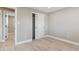 Bright bedroom with laminate wood flooring and sliding closet doors at 9525 Damon Dr, Northglenn, CO 80260