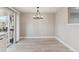 Dining room with neutral walls and a modern chandelier at 9525 Damon Dr, Northglenn, CO 80260