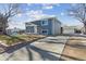 Gray exterior house with a landscaped yard and a two-car garage at 9525 Damon Dr, Northglenn, CO 80260