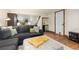 Finished basement with a cozy seating area, minifridge and storage, perfect for relaxing and entertaining at 7835 Valley View St, Louviers, CO 80131