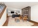 Finished basement featuring a large sofa, entertainment center, and a decorative bookshelf accent wall at 7835 Valley View St, Louviers, CO 80131