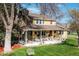 Beautiful two-story home with a sprawling front yard, inviting porch, and charming curb appeal at 7835 Valley View St, Louviers, CO 80131