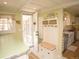 Inviting mud room features storage bench with drawers and a convenient back door at 7835 Valley View St, Louviers, CO 80131