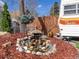 Charming water feature surrounded by landscaping, adding a tranquil touch to the property at 7835 Valley View St, Louviers, CO 80131