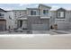 Charming two-story home with brick accents and a well-manicured front yard at 741 Simmental Loop, Castle Rock, CO 80104