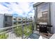 Outdoor balcony featuring a grill and seating, perfect for entertaining with a view of the cityscape at 2550 Lawrence St # Rb308, Denver, CO 80205