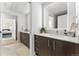 Modern bathroom featuring double vanity, sleek lighting, and neutral tones for a spa-like feel at 2550 Lawrence St # Rb308, Denver, CO 80205