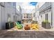 Inviting courtyard with colorful Adirondack chairs surrounding a cozy fire pit at 2550 Lawrence St # Rb308, Denver, CO 80205