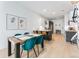 Bright dining area featuring modern table, chairs, and decor in an open-concept living space at 2550 Lawrence St # Rb308, Denver, CO 80205