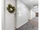 Hallway outside of a unit with a wreath on the door at 2550 Lawrence St # Rb308, Denver, CO 80205