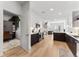 Modern kitchen featuring stainless appliances, white cabinets and hard wood floors, perfect for cooking and entertaining at 2550 Lawrence St # Rb308, Denver, CO 80205