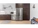 Modern kitchen featuring stainless appliances, white cabinets, and hard wood floors, perfect for cooking and entertaining at 2550 Lawrence St # Rb308, Denver, CO 80205