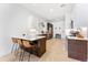 Open kitchen design with a large island, stainless steel appliances, and hardwood floors, great for entertaining at 2550 Lawrence St # Rb308, Denver, CO 80205