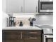 Modern kitchen featuring stainless appliances, white cabinets, and hard wood floors, perfect for cooking and entertaining at 2550 Lawrence St # Rb308, Denver, CO 80205