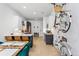 Open concept kitchen and dining area with bike racks on the wall at 2550 Lawrence St # Rb308, Denver, CO 80205