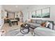 Spacious living room featuring stylish decor and bike storage in an open-concept living space at 2550 Lawrence St # Rb308, Denver, CO 80205