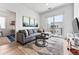 Inviting living room with a comfortable sofa and access to a private balcony and modern design at 2550 Lawrence St # Rb308, Denver, CO 80205