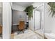 A bright room that could be a home office with a built-in Murphy bed and a patterned rug at 2550 Lawrence St # Rb308, Denver, CO 80205