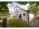 Spacious backyard with wooden fence, lush green lawn, and private patio area at 11586 Chase Way, Westminster, CO 80020