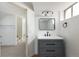 Modern bathroom vanity with matte black fixtures and ample storage at 11586 Chase Way, Westminster, CO 80020