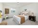 Cozy bedroom with natural light, neutral color palette, and comfortable furnishings at 11586 Chase Way, Westminster, CO 80020