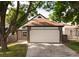 Well-maintained home exterior with manicured lawn, attached garage and brick accents at 11586 Chase Way, Westminster, CO 80020