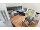 Aerial view of the kitchen featuring dark green cabinets, stainless steel appliances, and an adjacent dining area at 11586 Chase Way, Westminster, CO 80020