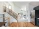 Bright and open living area with staircase, high ceilings, and stylish furnishings at 11586 Chase Way, Westminster, CO 80020