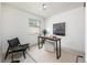 Bright, airy office space with a modern desk, large window, and neutral color scheme at 11586 Chase Way, Westminster, CO 80020