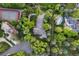 Expansive property featuring lush landscaping, a private tennis court, and a circular driveway at 2 University Ln, Greenwood Village, CO 80121
