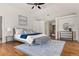 Bright main bedroom features vaulted ceilings, hardwood floors, and a stylish sitting area with natural light at 2 University Ln, Greenwood Village, CO 80121