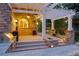 Outdoor kitchen with a built-in grill, stone countertops, and a covered pergola at 2 University Ln, Greenwood Village, CO 80121
